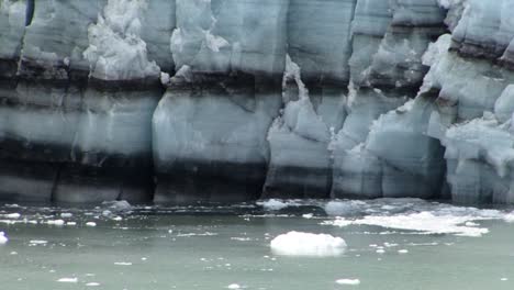 black sediment lines in the margerie glacier in alaska's glacier bay national park