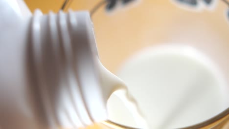 pouring milk into a glass