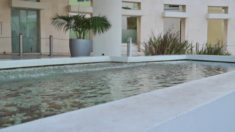 Slow-Motion-Of-Water-Dropping-At-The-Fountain-Of-A-Hotel