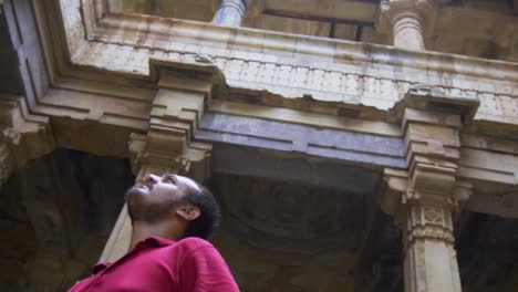 man exploring kevada mosque is a mosque in champaner, gujarat state. it is also known as kevda masjid. it is part of the champaner-pavagadh archaeological park, a unesco world heritage site.
