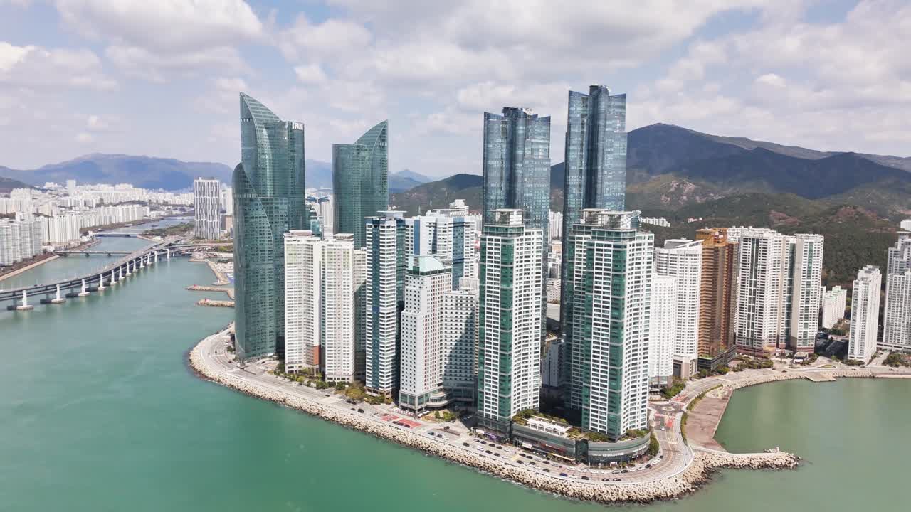 Aerial view of a modern city with skyscrapers on the coast