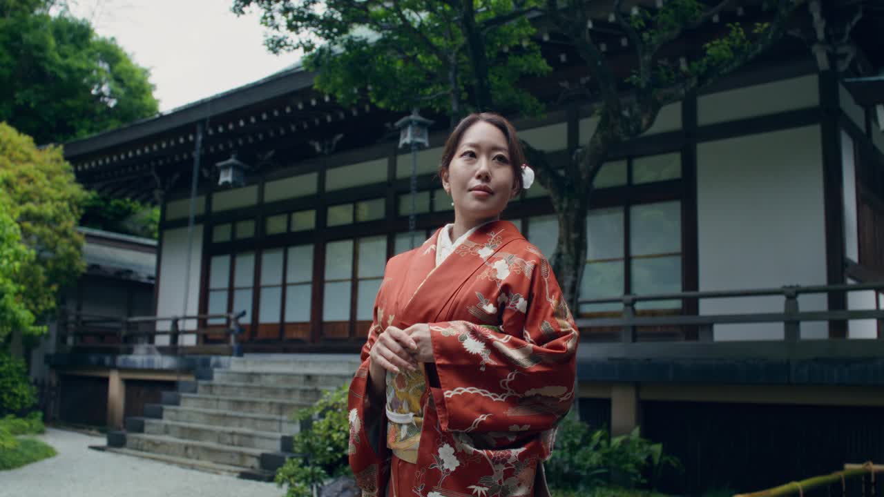 Woman in Traditional Japanese Kimono at a Temple