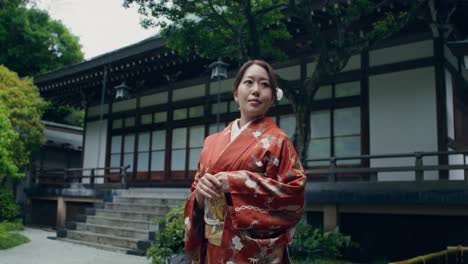 woman in traditional japanese kimono at a temple