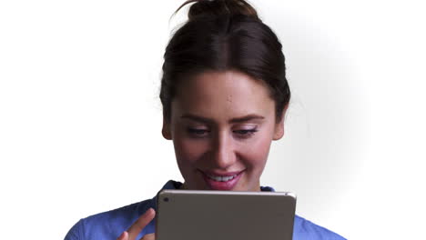 shot of woman using digital tablet against white background