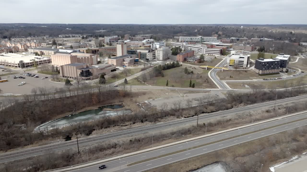 Western Michigan University campus in Kalamazoo, Michigan with drone video moving in.