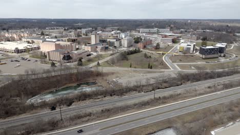 western michigan university campus in kalamazoo, michigan with drone video moving in.