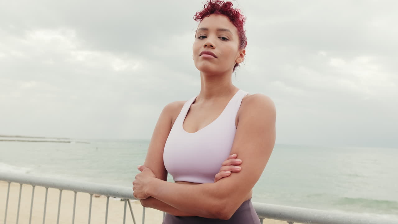 Fitness Woman at Beach with Arms Crossed