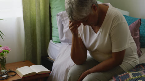 senior woman in social distancing in her room of retirement house