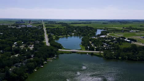 a drone flying over killarney lake during the summer in south west manitoba canada