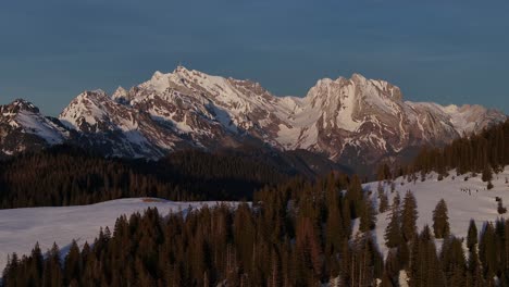 crisp light on amden's mountain tops at dawn, switzerland - aerial