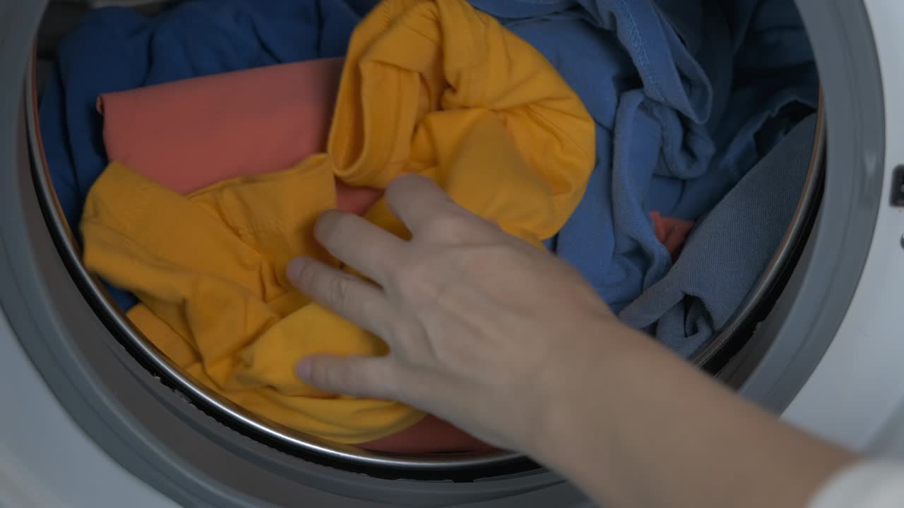 Home washing laundry.