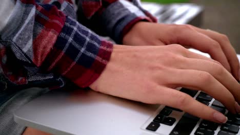 woman hands typing on laptop keyboard. hands typing computer