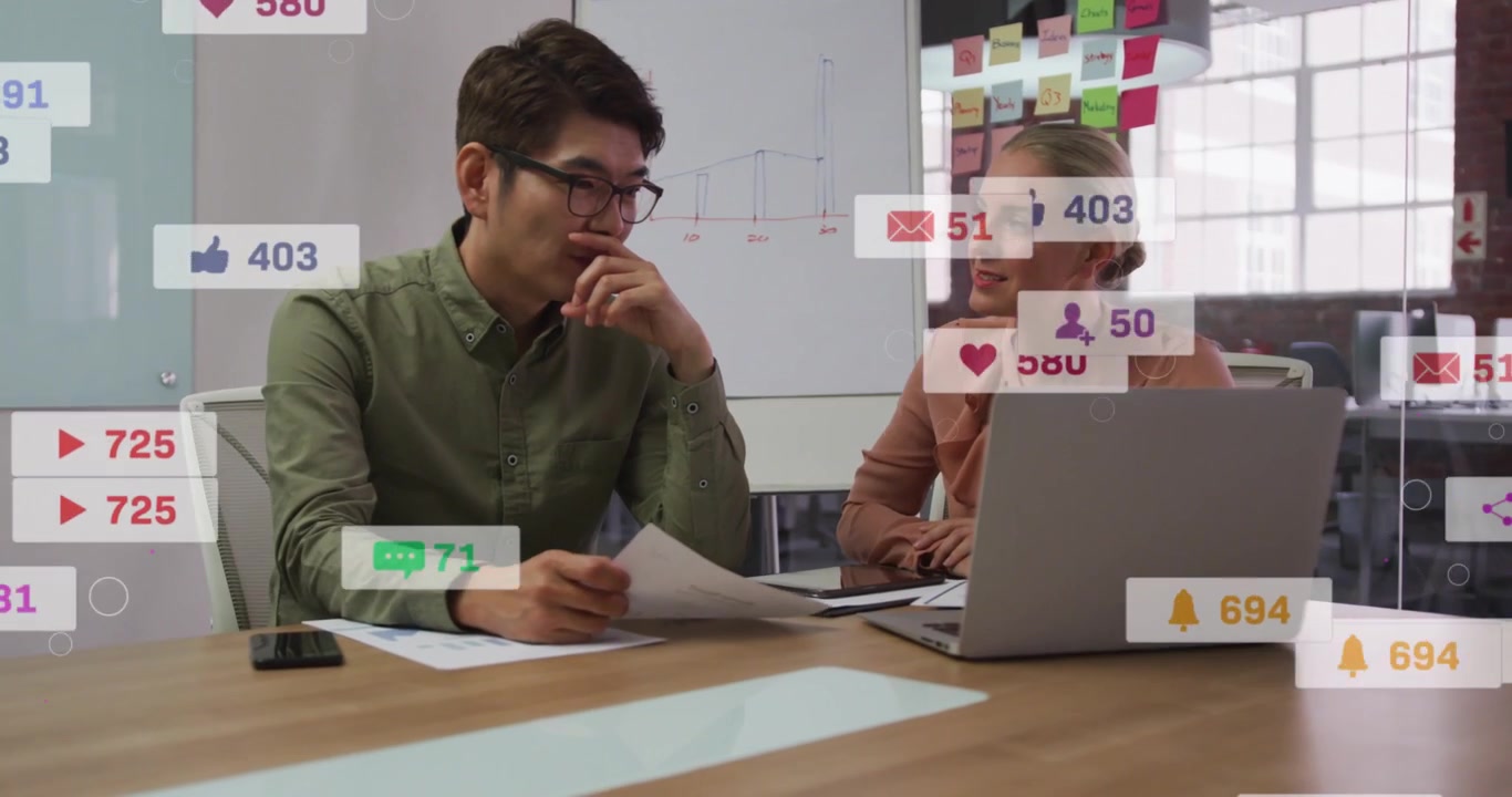 Analyst pointing printed reports, lead typing, causing social stats appearing,fading for marketing