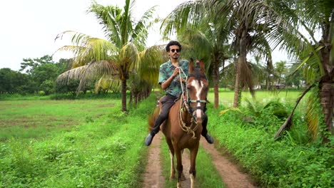 Young-handsome-man-with-brown-horse