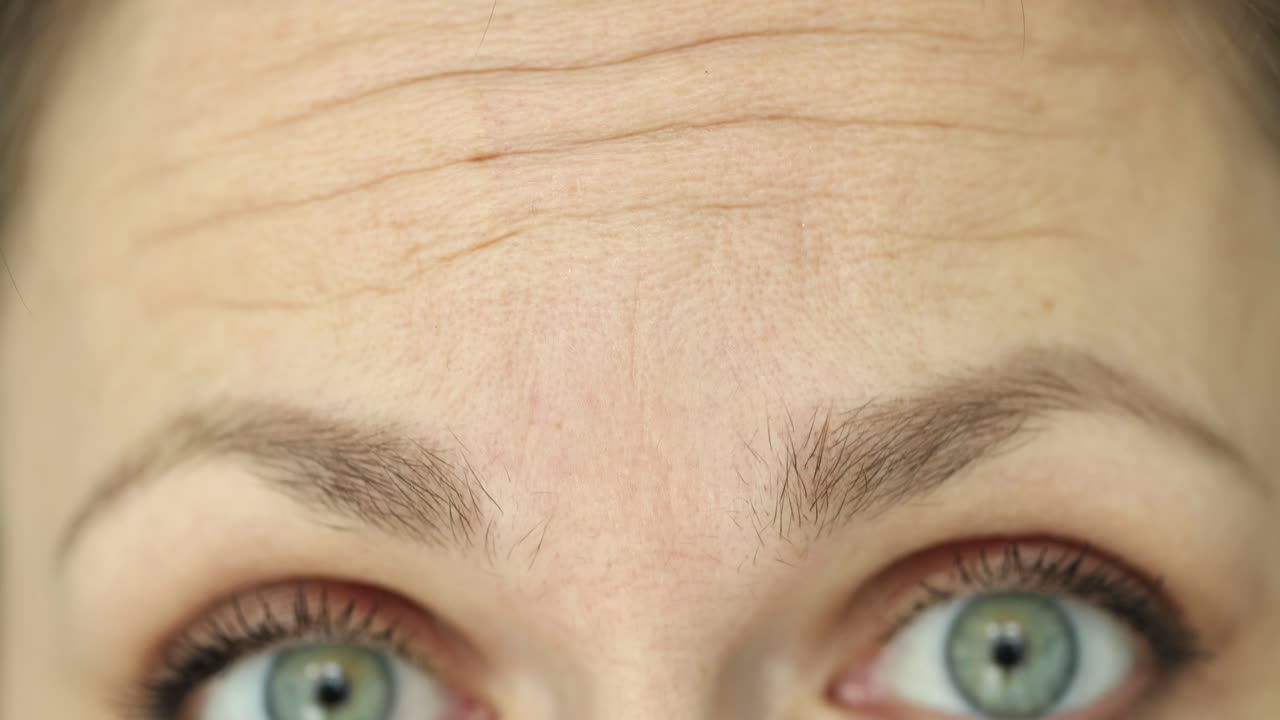 Close-up of a woman's face showing forehead and eyes