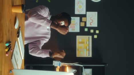 happy black businessman celebrating success in office