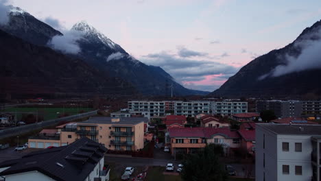 pedestal up showing the city of martigny in the swiss alps at sunset