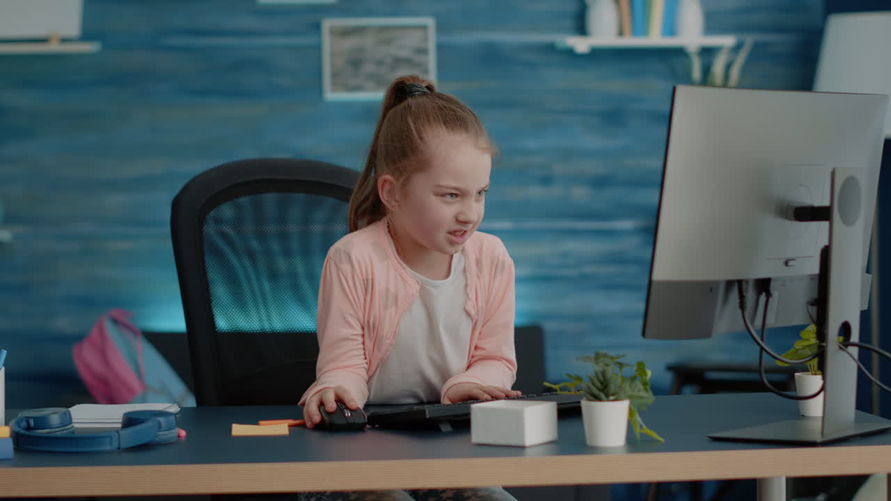 Frustrated child attending online classes on computer