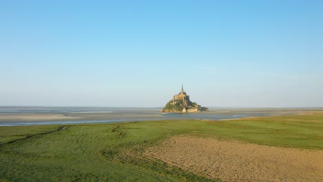 the verdant normandy countryside facing mont saint michel in europe, france, normandy, manche, in spring, on a sunny day.