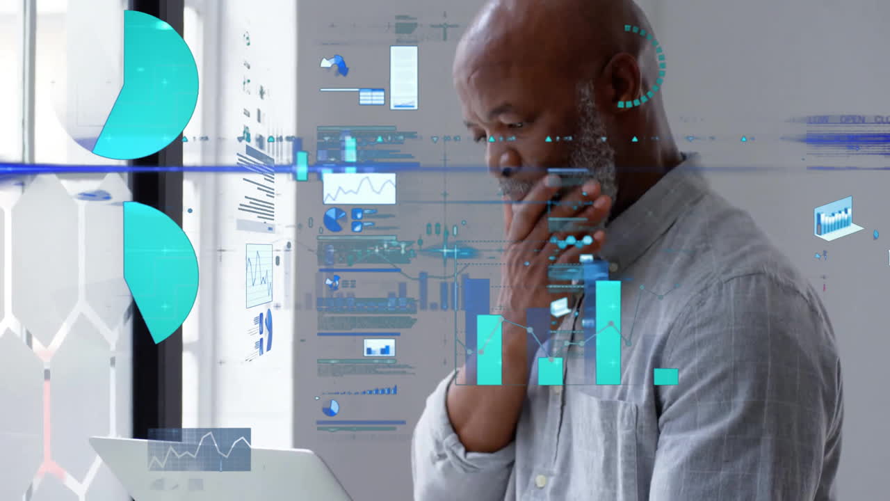 Animation of data processing over african american businessman using laptop in office