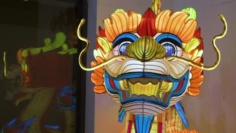 view of a dragon lantern installation illuminated outside the china cultural centre commemorating the upcoming chinese lunar new year 2024, the year of the dragon in spain