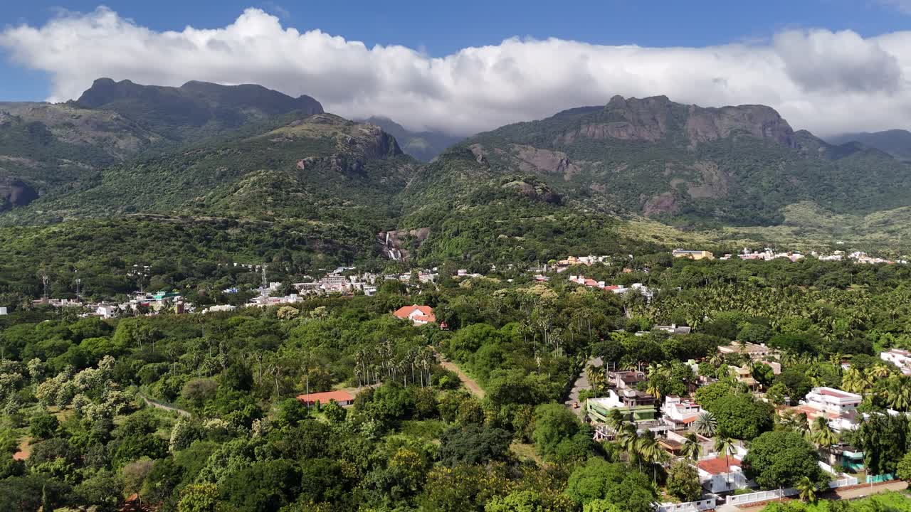 Aerial panoramic view of Courtallam falls (Kuttalam) town nestled in the foothills of the Western Ghats, Tamil Nadu, South India