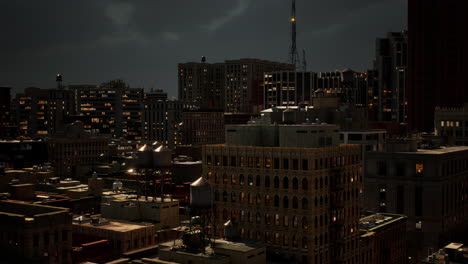 dark city at night: aerial view of urban skyline