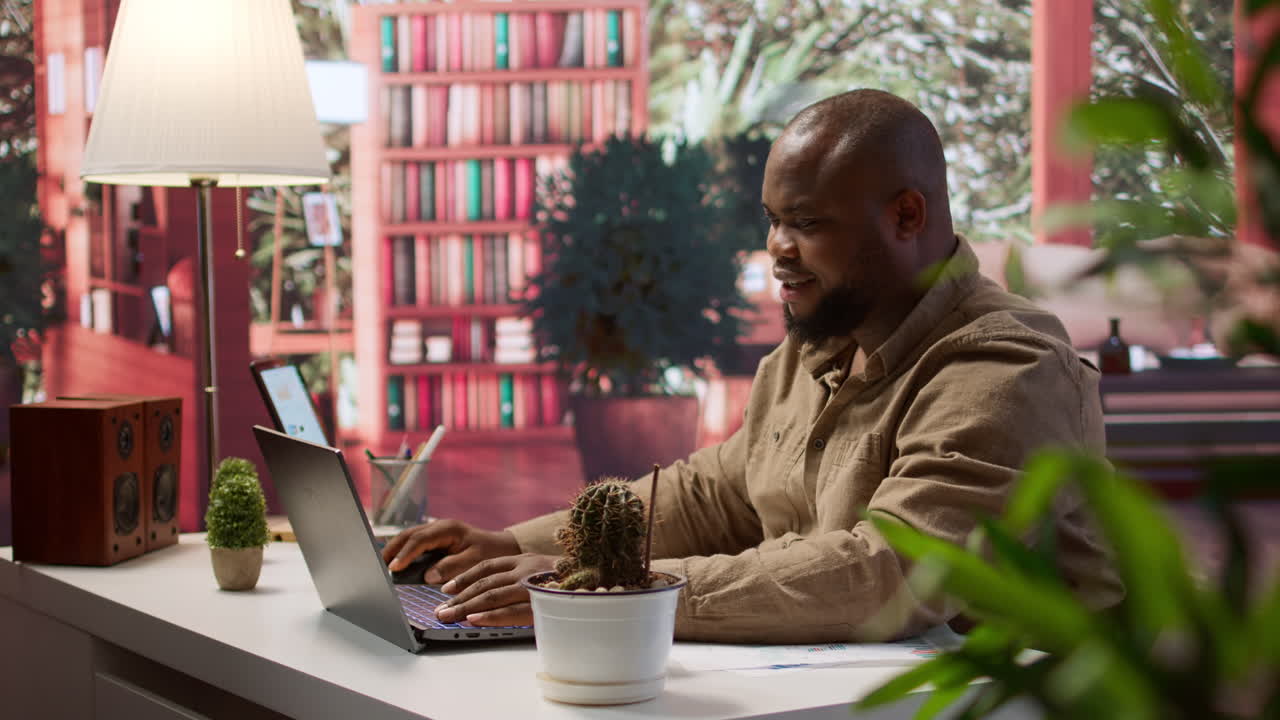 Successful freelancer using his laptop for remote business tasks