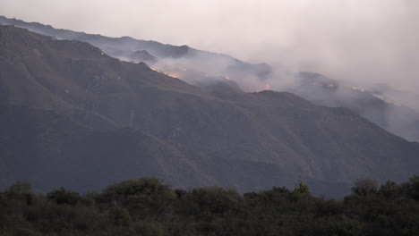 huge mountain fire with flames and smoke