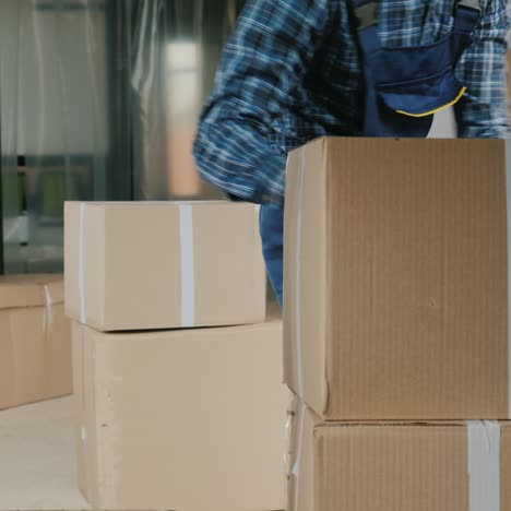 Wholesale-Warehouse-Worker-Loads-Cardboard-Boxes-Into-The-Trunk-Of-A-Van