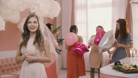 happy bachelor girl showing her engagement ring to the camera