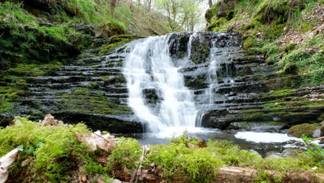 waterfall in forest in the uk slider shot