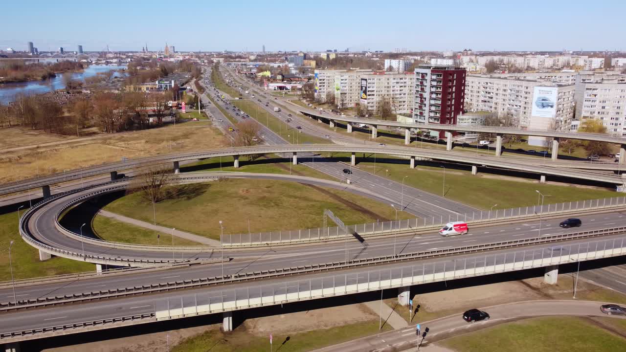 Aerial establisher shot of busy intersection and urban commute in Riga, daytime