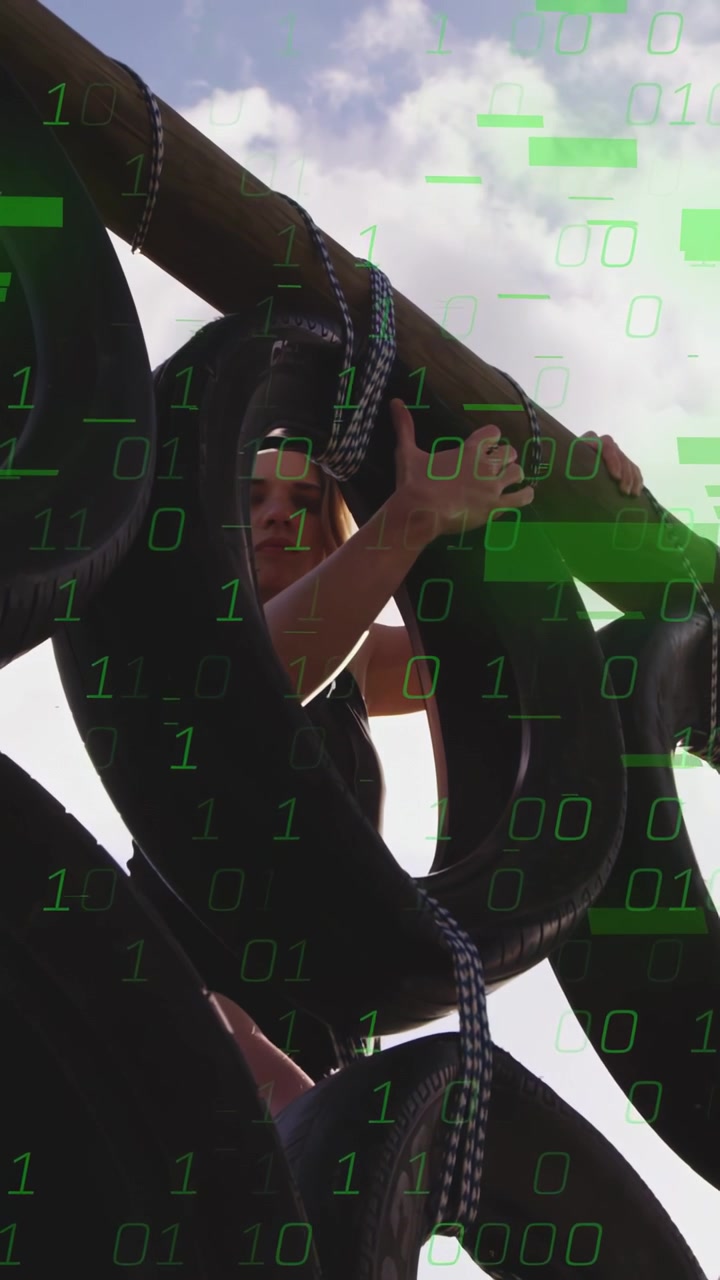 Vertical video: Grip launching woman climbing tire loops, pulling up to top as green overlay grows