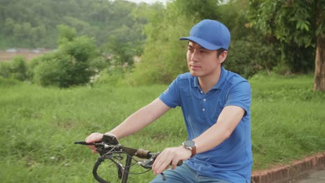 asian man rides a electric scooter on the road to deliver orders and packages for customers