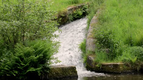 man made waterfall on a northern english canal in the small town of todmorden