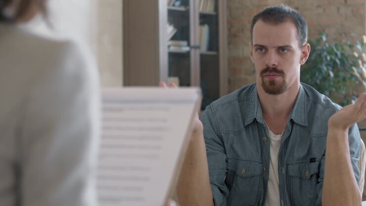 Frustrated Man Talking to Therapist