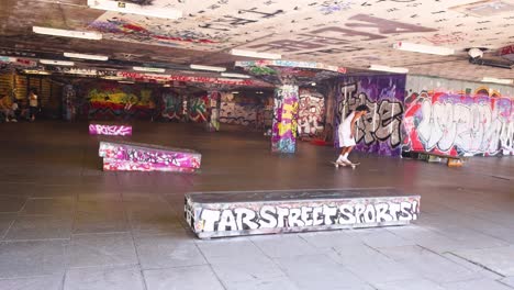 skateboarder performing tricks in urban skatepark