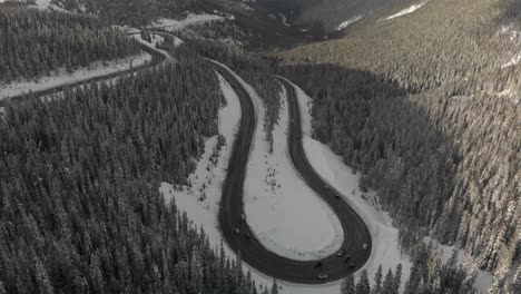 Aerial:-Steady-traffic-on-big-loop-switchback,-Berthoud-Pass,-Colorado