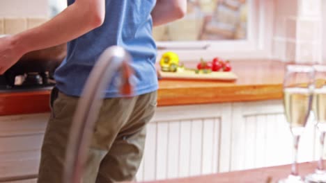 homosexual couple cooking in a wok