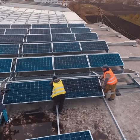 drone view over solar farm. aerial view of photovoltaic solar panels mounted on building roof