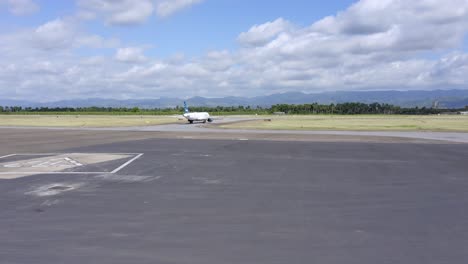 airplane on the taxiway of cibao international airport in santiago de los caballeros, dominican republic