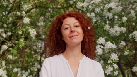 woman in a spring blossom garden