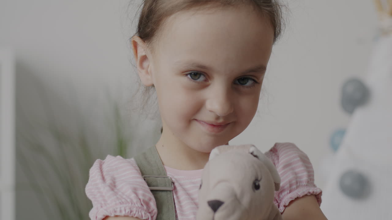 Girl Hugging a Stuffed Animal