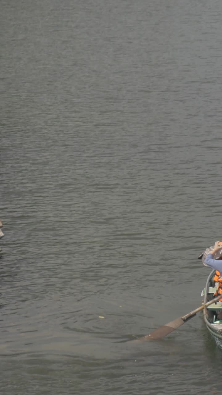 Traditional Boats with Tourists and Operators on a River