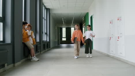 pupils walking through the corridor.