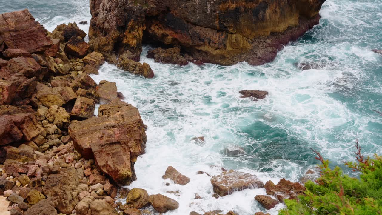Ocean Waves Crashing On Rocks And Cliffs In The Coastline Of Algarve In Portugal. - static shot