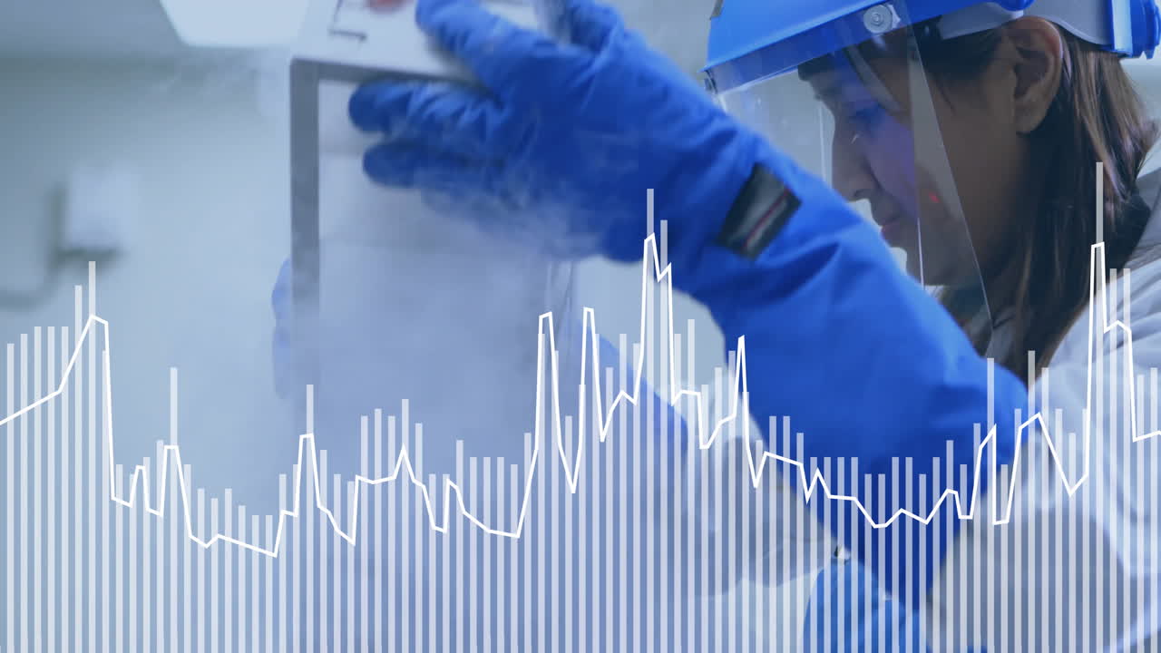 Handling equipment with data graph overlay, scientist in protective gear working