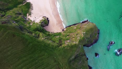 Birds-eye-view-drone-shot-of-the-steep-cliffs-at-Traigh-Mhor-beach-in-Tolsta-on-the-Outer-Hebrides-of-Scotland