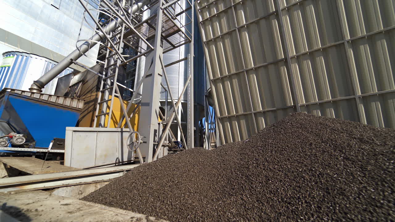 Factory for the production of mixed fodders. Industrial equipment on a compound feed plant. Grain elevator.
